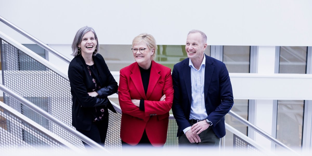 Three persons on a staircase